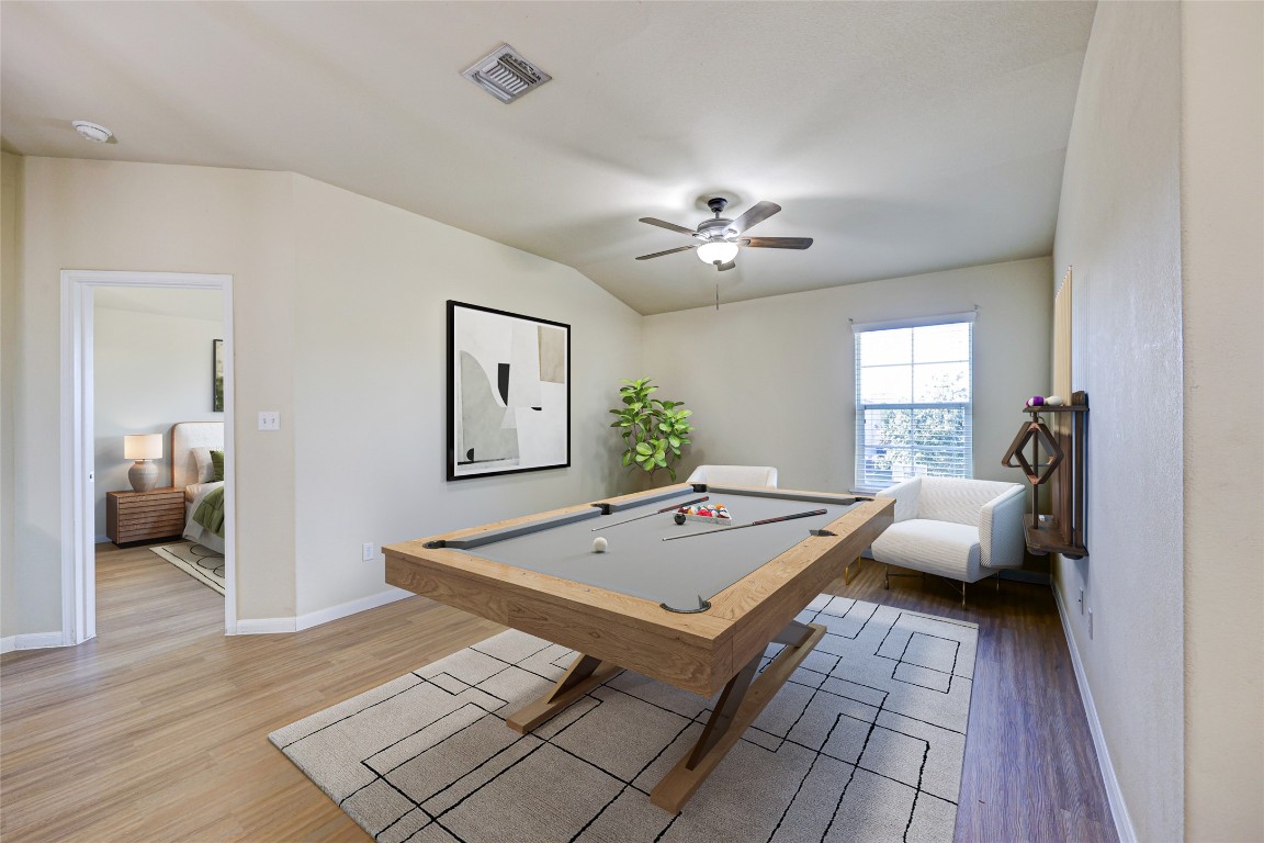 267 Voyager Cove Kyle, TX 78640 - Photo 6 of 40 a living room with furniture and wooden floor