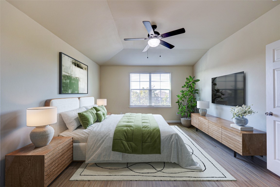 267 Voyager Cove Kyle, TX 78640 - Photo 7 of 40 a spacious bedroom with a large bed and a window
