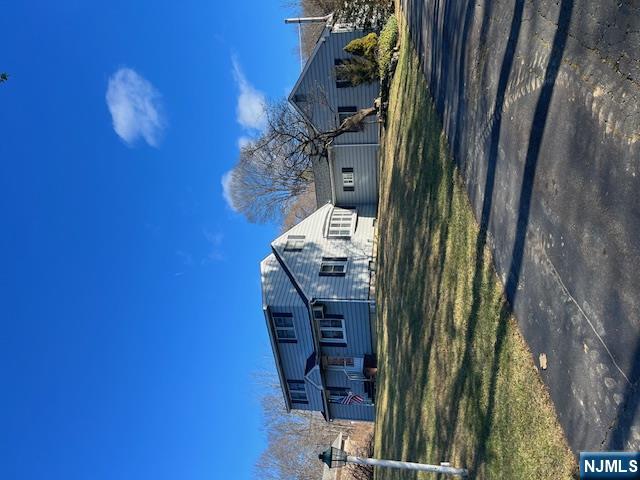 a view of a big house with a big yard