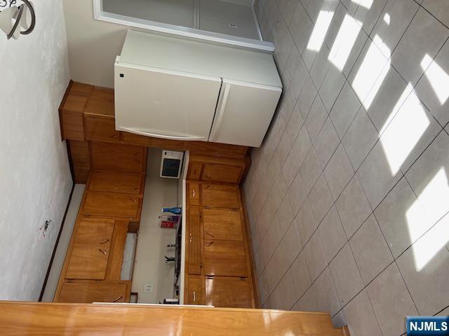 404 Stonetown Road Ringwood, NJ 07456 - Photo 11 of 13 a kitchen with refrigerator and cabinets