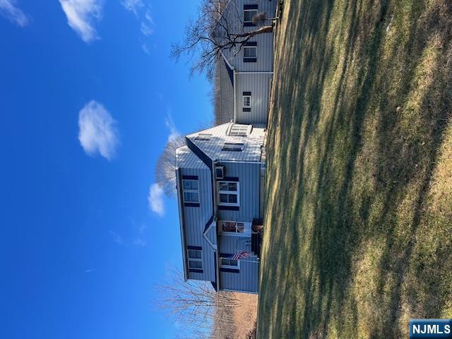 404 Stonetown Road Ringwood, NJ 07456 - Photo 2 of 13 a view of a house with a big yard