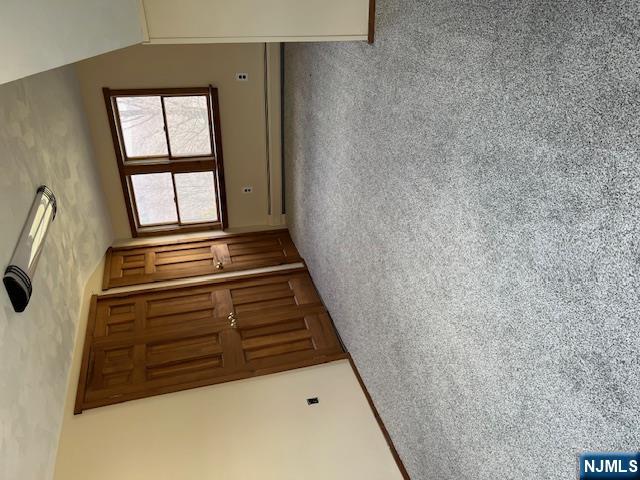 404 Stonetown Road Ringwood, NJ 07456 - Photo 6 of 13 an empty room with windows