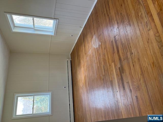 404 Stonetown Road Ringwood, NJ 07456 - Photo 10 of 13 an empty room with wooden floor and windows