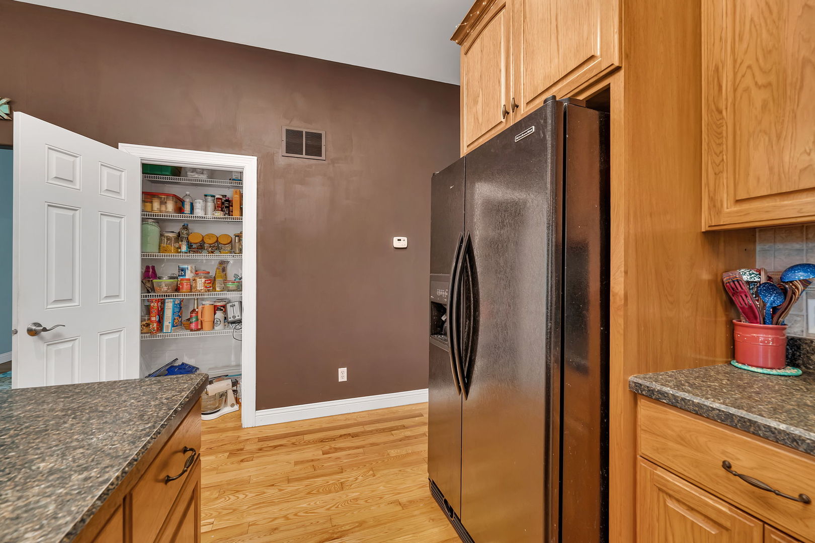 300 Village Lane Seneca, IL 61360 - Photo 13 of 42 a kitchen with stainless steel appliances granite countertop a refrigerator and a sink