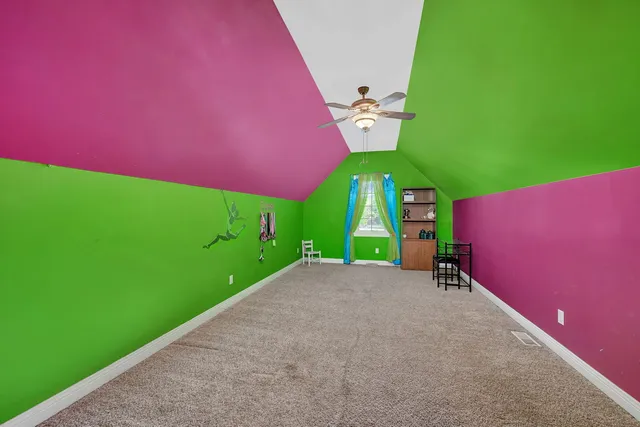 a green field with sign in front of it