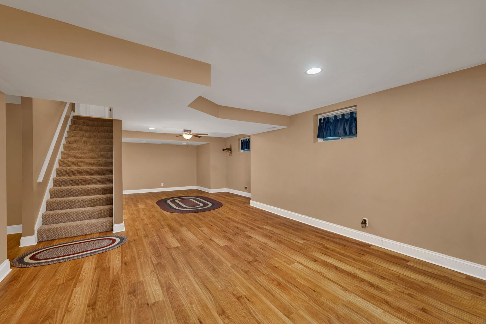 300 Village Lane Seneca, IL 61360 - Photo 25 of 42 a view of an empty room with wooden floor and stairs