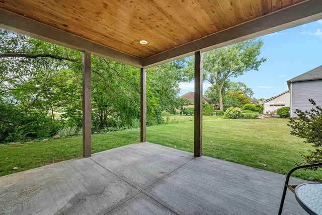 a view of a porch with a big yard