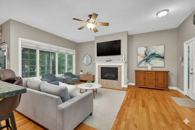 a living room with furniture fireplace and a flat screen tv