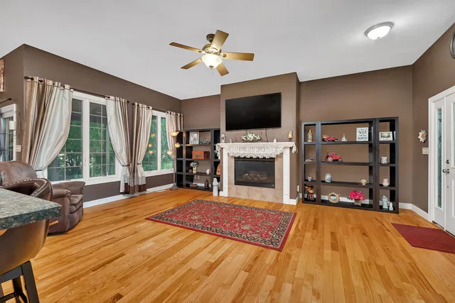 a living room with fireplace furniture and a flat screen tv
