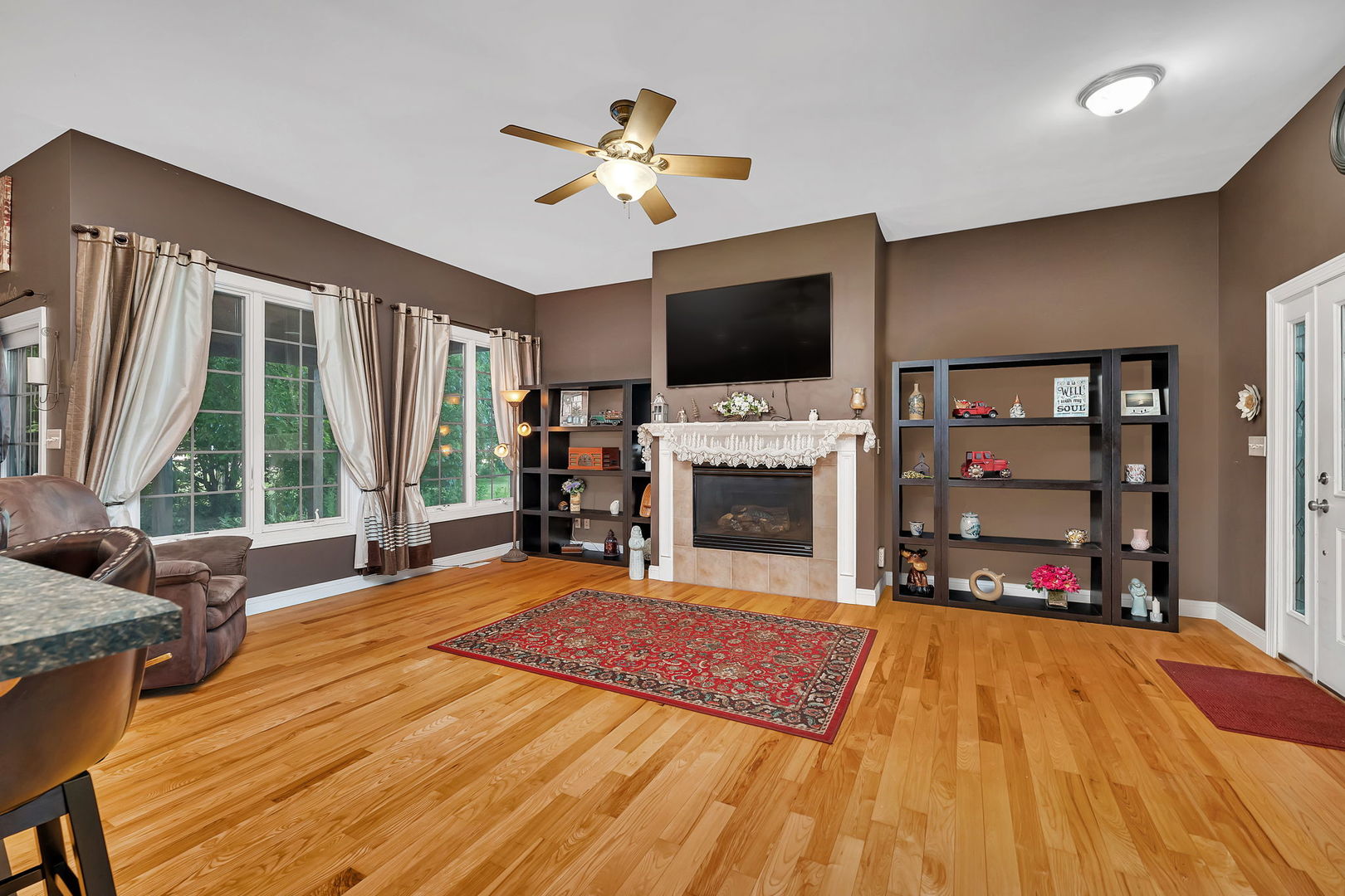 300 Village Lane Seneca, IL 61360 - Photo 6 of 42 a living room with fireplace furniture and a flat screen tv