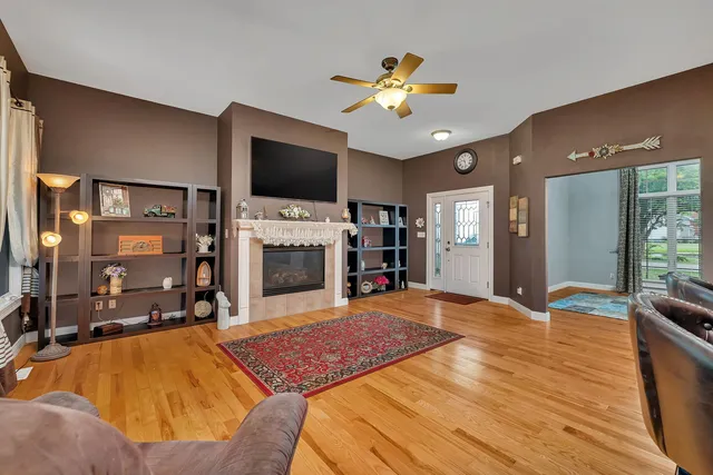 a spacious bedroom with a bed and a flat screen tv