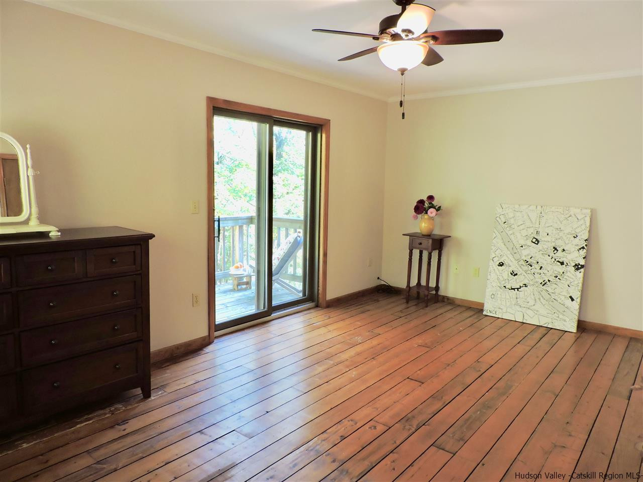2579 Vega Mountain Road Roxbury, NY 12421 - Photo 23 of 34 a view of an empty room with a window and wooden floor