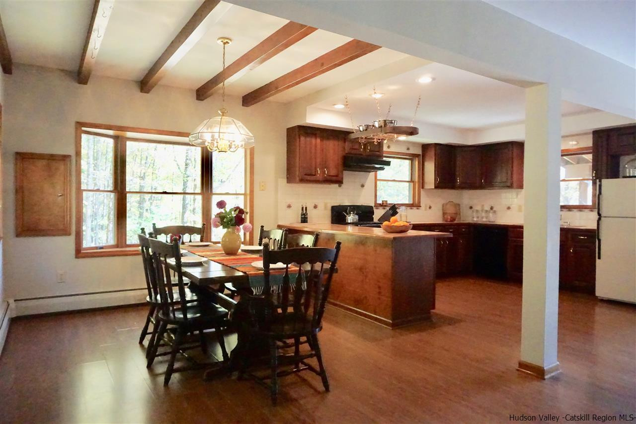 2579 Vega Mountain Road Roxbury, NY 12421 - Photo 7 of 34 a view of a dining room with furniture and wooden floor