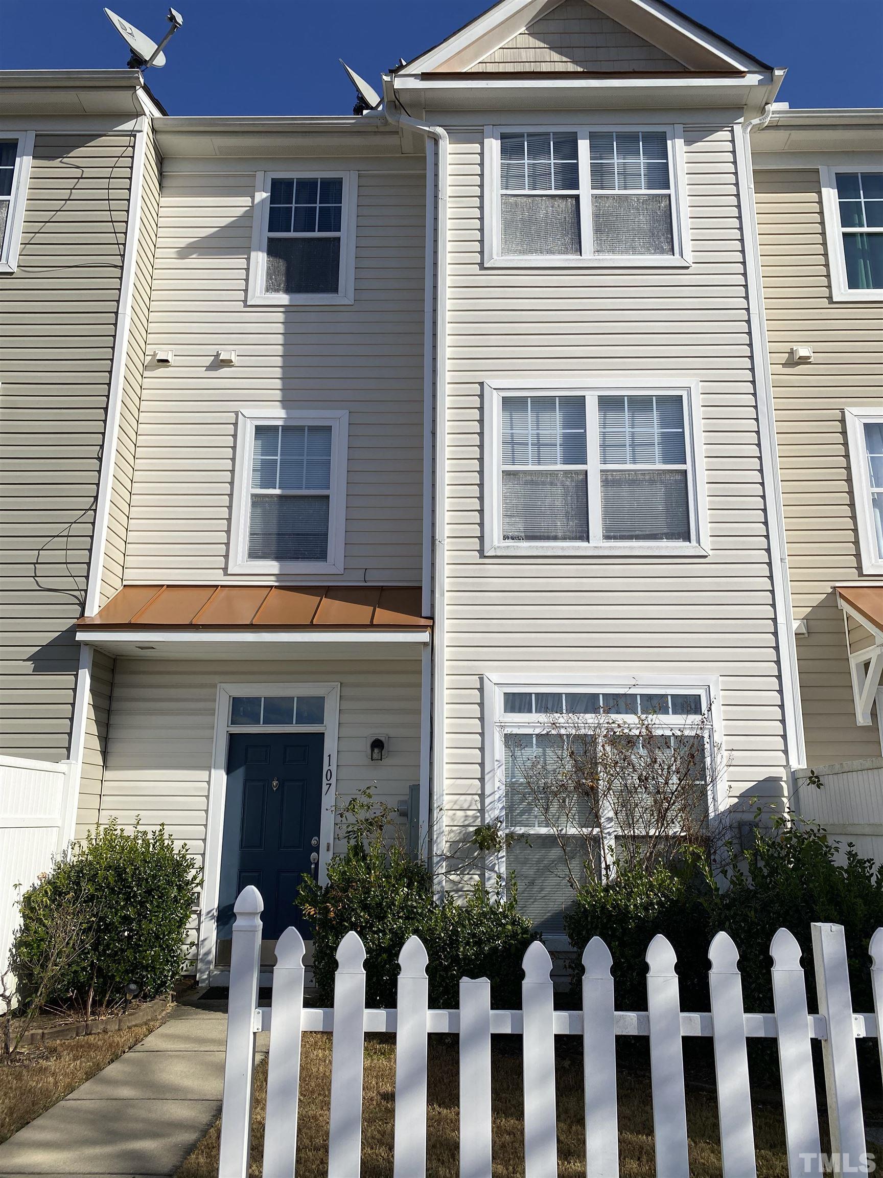 11711 Coppergate Drive, Unit 107 Raleigh, NC 27614 - Photo 1 of 10 a front view of a house with a yard