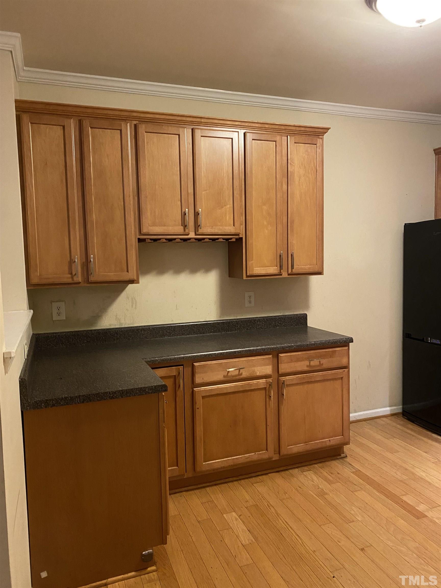 11711 Coppergate Drive, Unit 107 Raleigh, NC 27614 - Photo 3 of 10 a kitchen with granite countertop cabinets stainless steel appliances a sink and a window