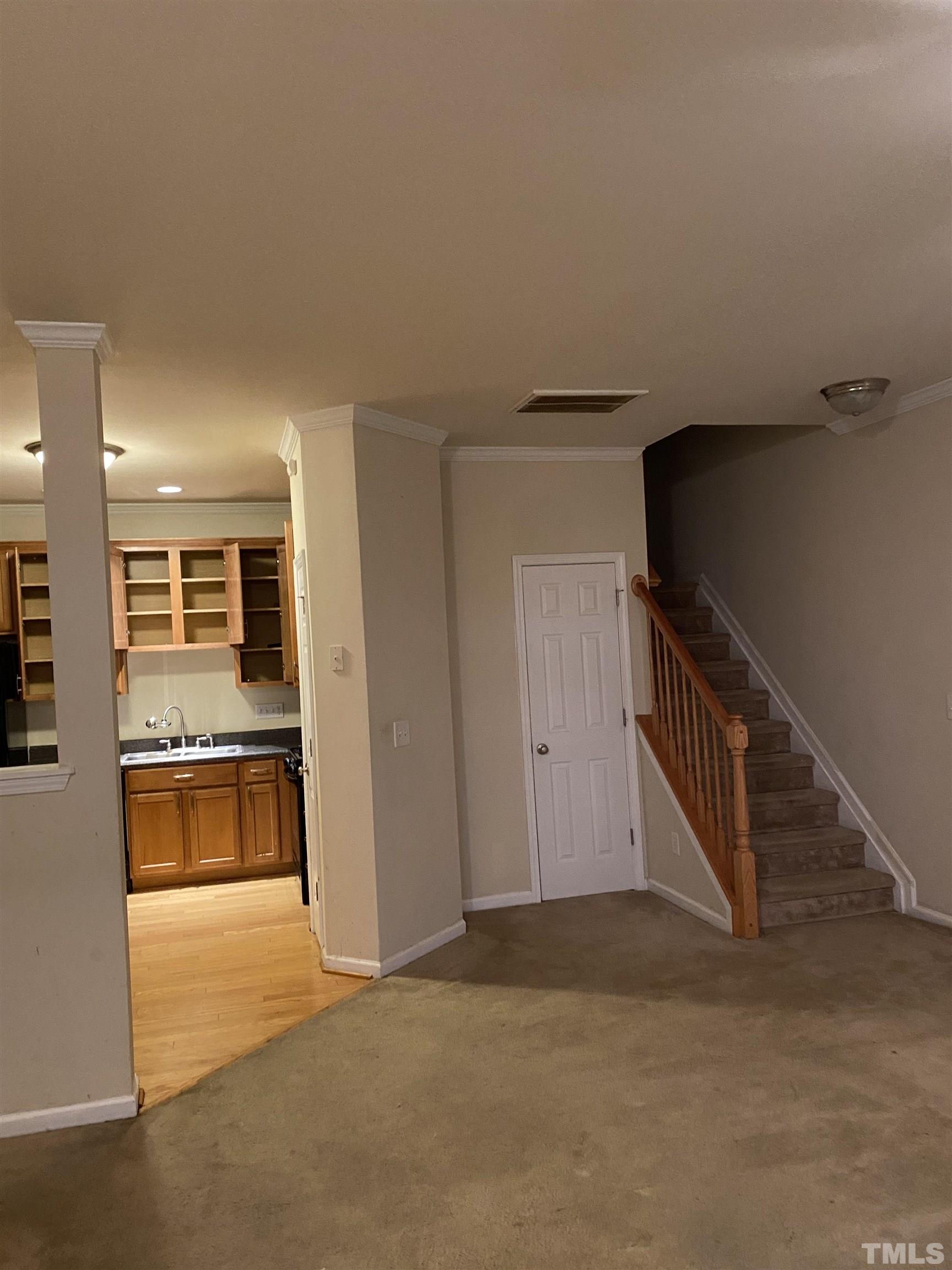 11711 Coppergate Drive, Unit 107 Raleigh, NC 27614 - Photo 5 of 10 a view of a kitchen with a sink and cabinets