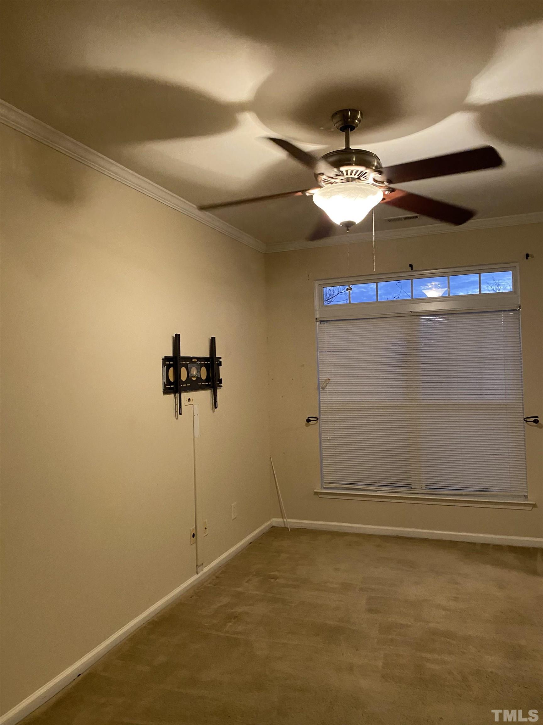 11711 Coppergate Drive, Unit 107 Raleigh, NC 27614 - Photo 6 of 10 a view of a room with a ceiling fan