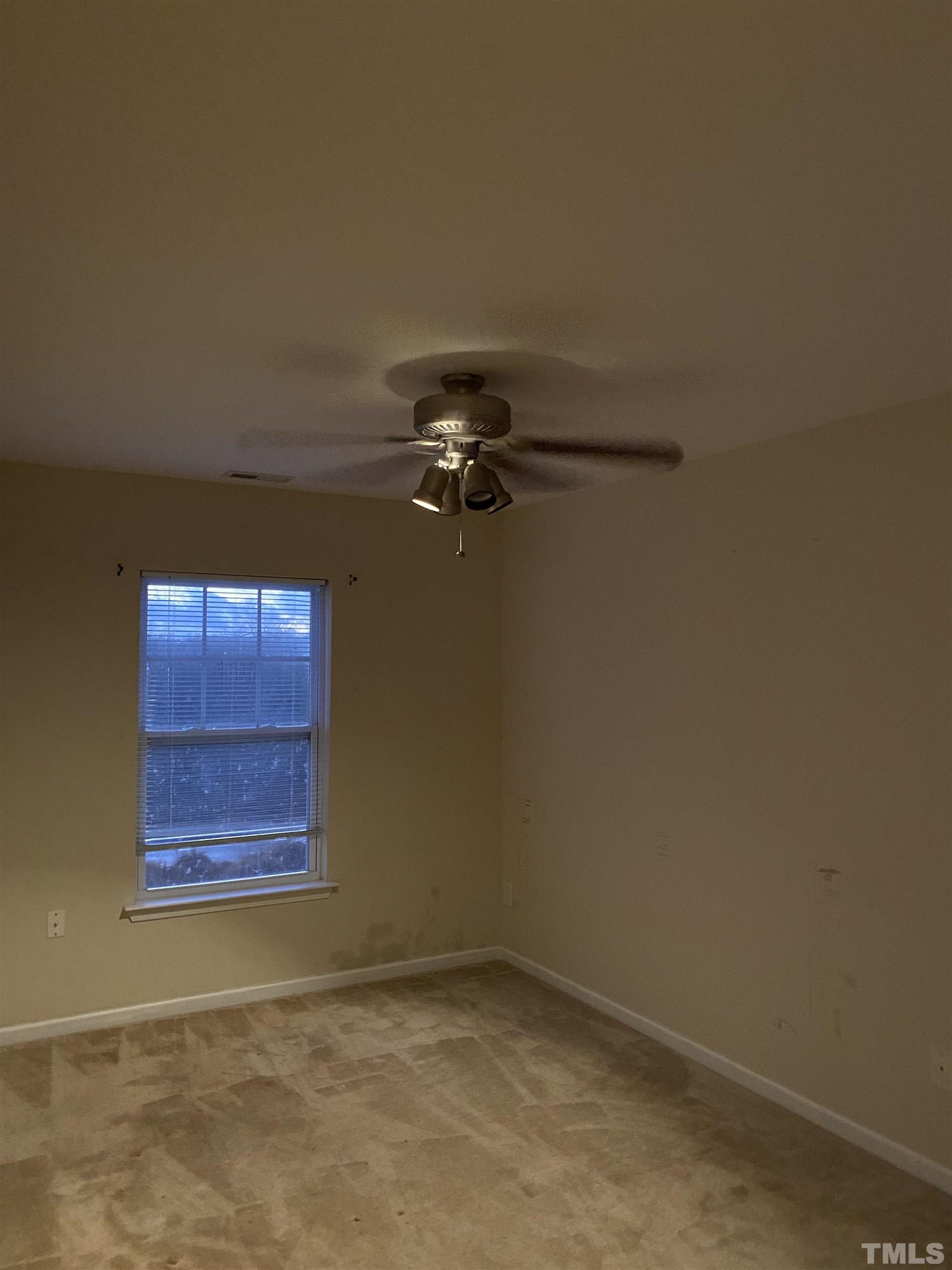 11711 Coppergate Drive, Unit 107 Raleigh, NC 27614 - Photo 9 of 10 an empty room with windows