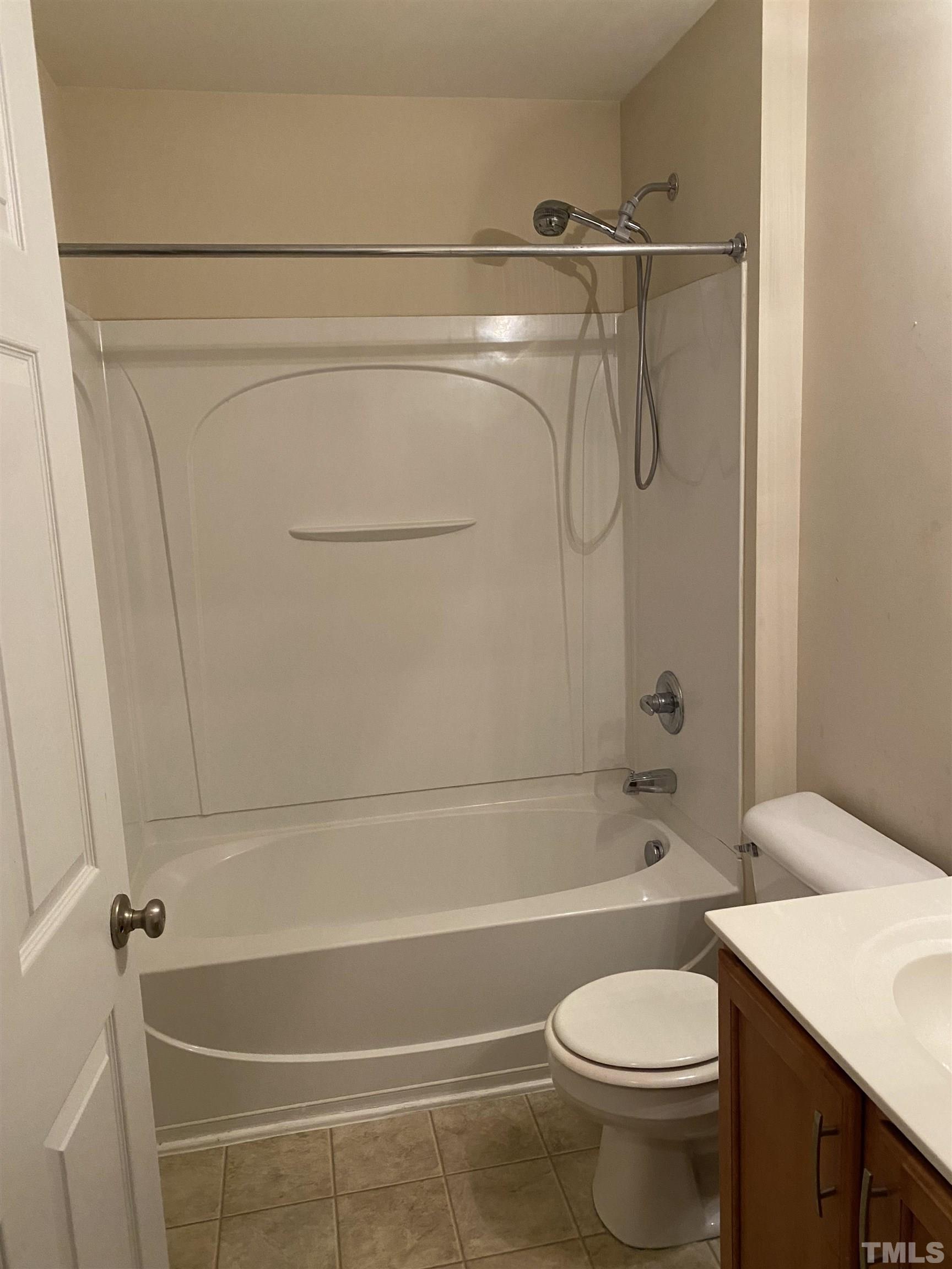 11711 Coppergate Drive, Unit 107 Raleigh, NC 27614 - Photo 10 of 10 a bathroom with a shower a toilet and a sink