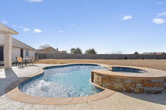 a view of a living room and kitchen