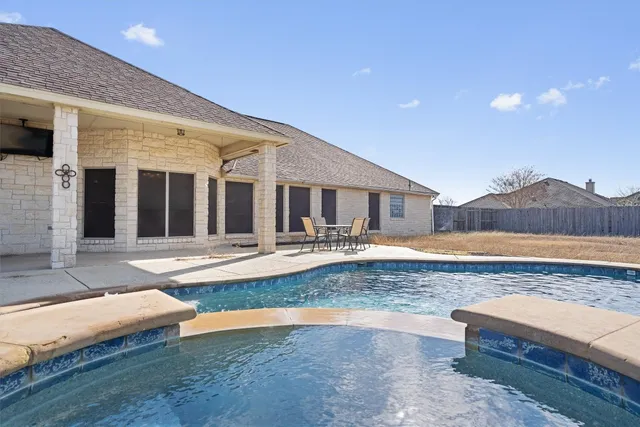 a view of a living room and kitchen