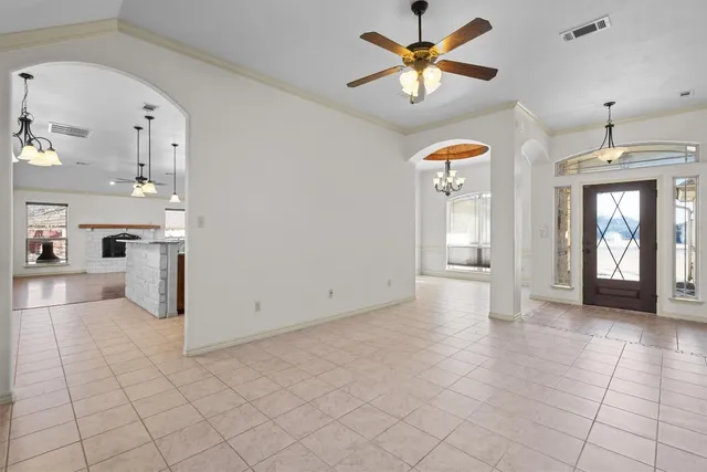 a view of a kitchen with furniture and windows