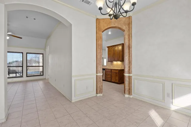 a view of a bathroom with a tub mirror and window