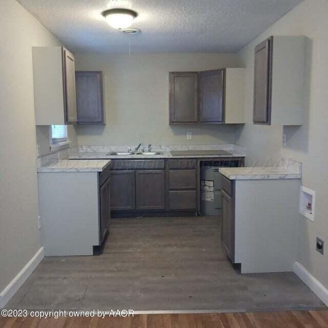 1408 Southwest 12th Avenue Amarillo, TX 79102 - Photo 17 of 25 a kitchen with a sink cabinets and appliances