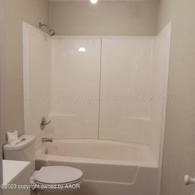 1408 Southwest 12th Avenue Amarillo, TX 79102 - Photo 21 of 25 a bathroom with a toilet and a shower