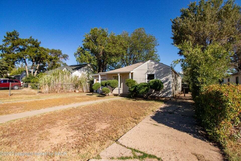1408 Southwest 12th Avenue Amarillo, TX 79102 - Photo 3 of 25 a view of a house with a yard
