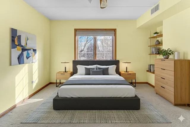 a bedroom with a bed and with furniture