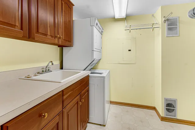 a kitchen with a sink and a refrigerator