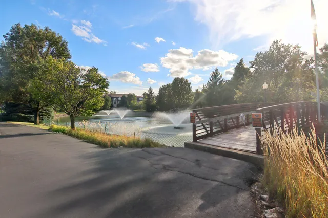 a view of a pathway with a wrought fence