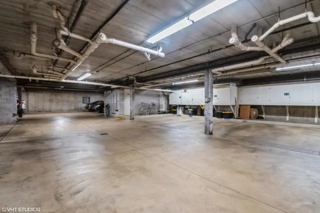 a view of parking garage with cars