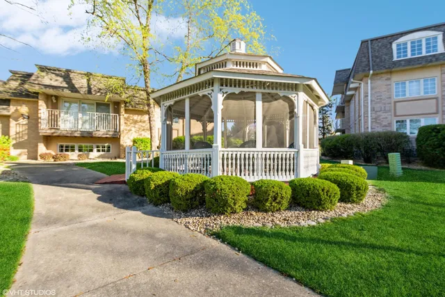 a view of a house with a yard and plants