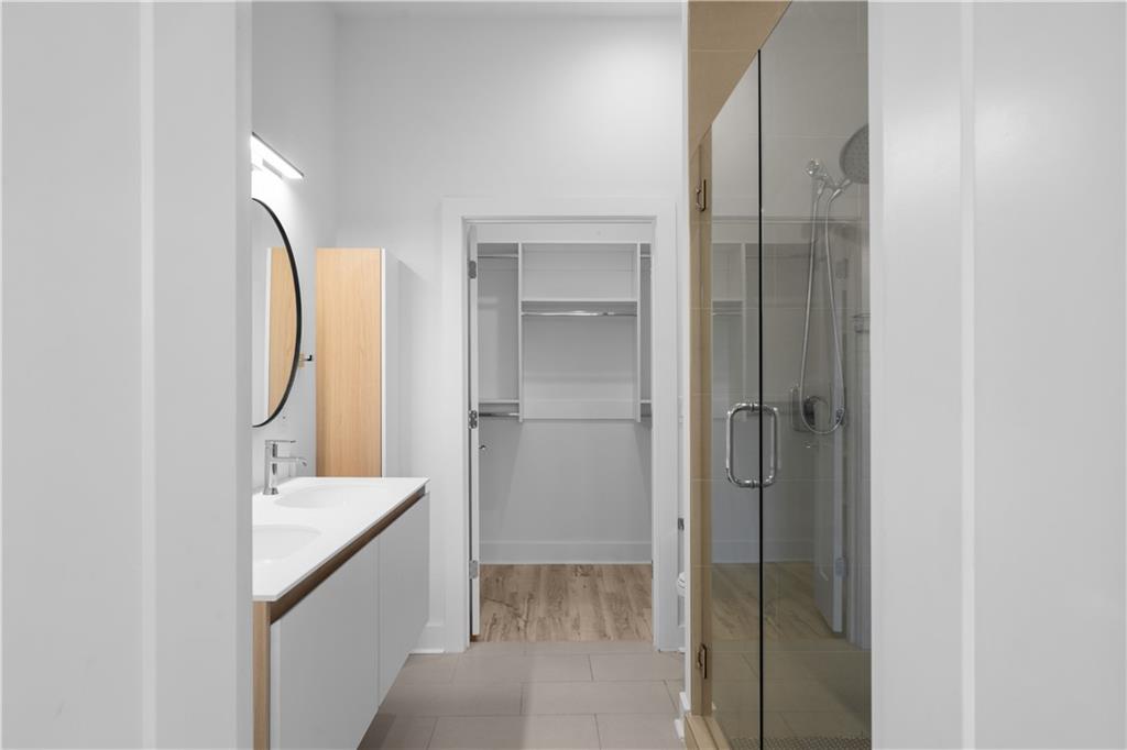 1155 Custer Avenue Southeast, Unit 301 Atlanta, GA 30316 - Photo 11 of 22 a bathroom with a sink and a mirror