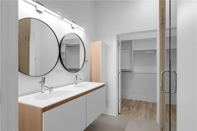 a view of walk in closet with empty racks