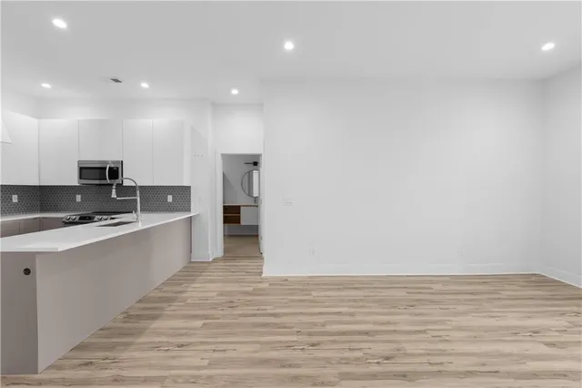 a view of hallway with washer and dryer