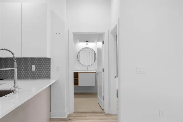 a view of an empty room and a window