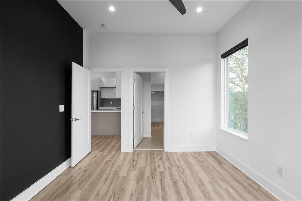 1155 Custer Avenue Southeast, Unit 301 Atlanta, GA 30316 - Photo 18 of 22 wooden floor in an empty room with a window