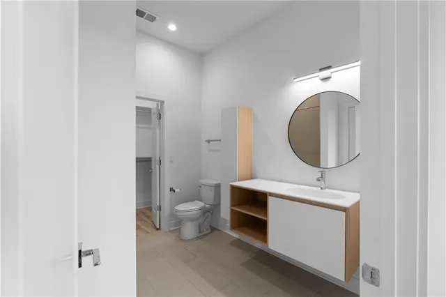 a bathroom with a sink a mirror and a bathtub