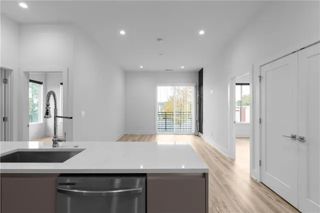a view of kitchen with wooden floor