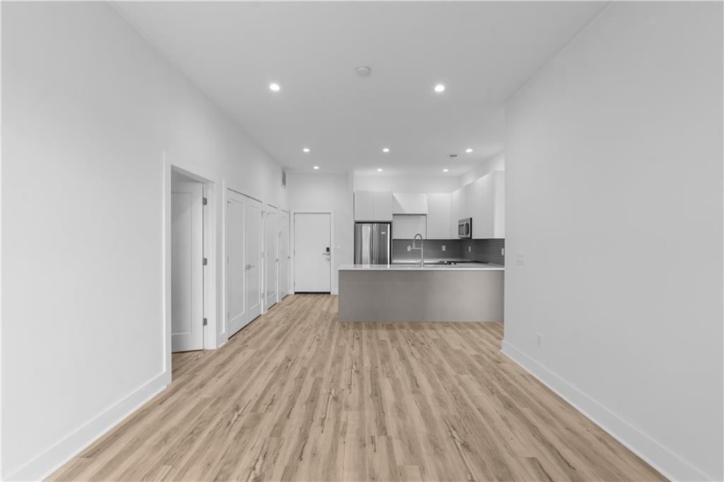 1155 Custer Avenue Southeast, Unit 301 Atlanta, GA 30316 - Photo 4 of 22 a view of kitchen with wooden floor