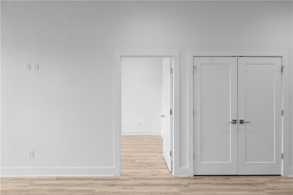 1155 Custer Avenue Southeast, Unit 301 Atlanta, GA 30316 - Photo 8 of 22 a view of a livingroom with wooden floor