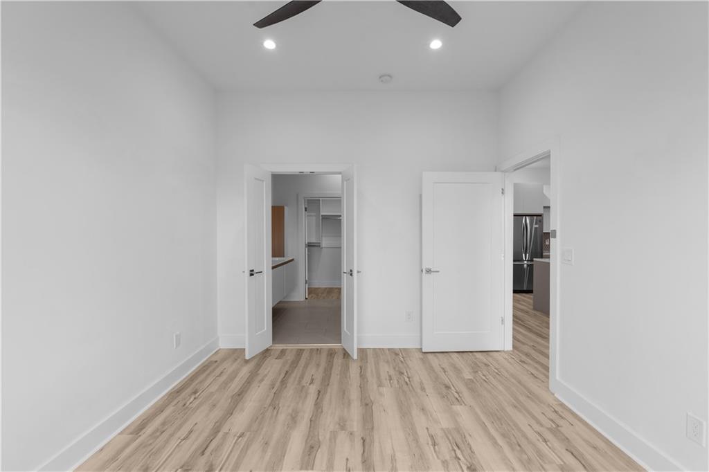 1155 Custer Avenue Southeast, Unit 301 Atlanta, GA 30316 - Photo 10 of 22 a view of a room with wooden floor and a hallway
