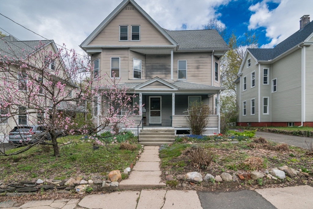 a front view of a house with garden