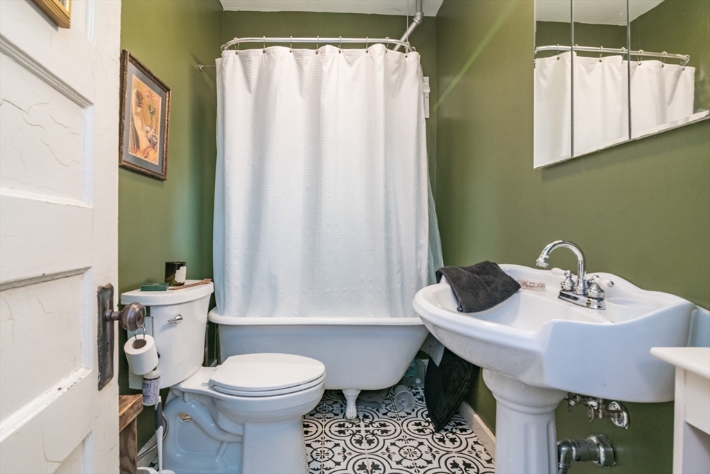 25 Morgan Street Holyoke, MA 01040 - Photo 15 of 41 a bathroom with a sink toilet and shower
