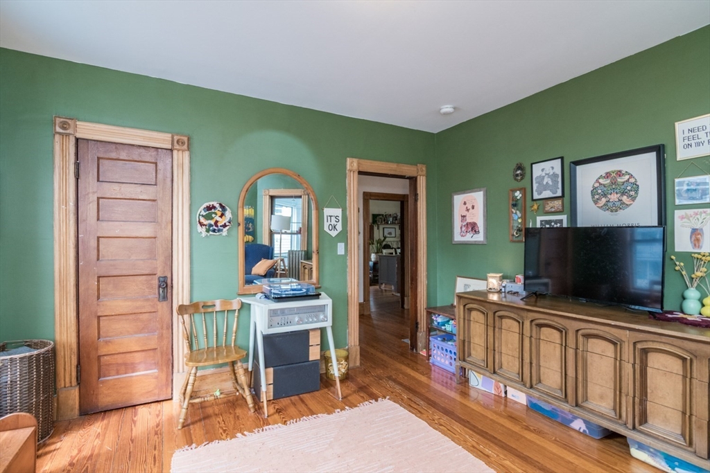 25 Morgan Street Holyoke, MA 01040 - Photo 17 of 41 a bedroom with furniture and a flat screen tv