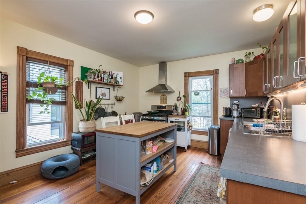 25 Morgan Street Holyoke, MA 01040 - Photo 20 of 41 a kitchen with a stove and a refrigerator