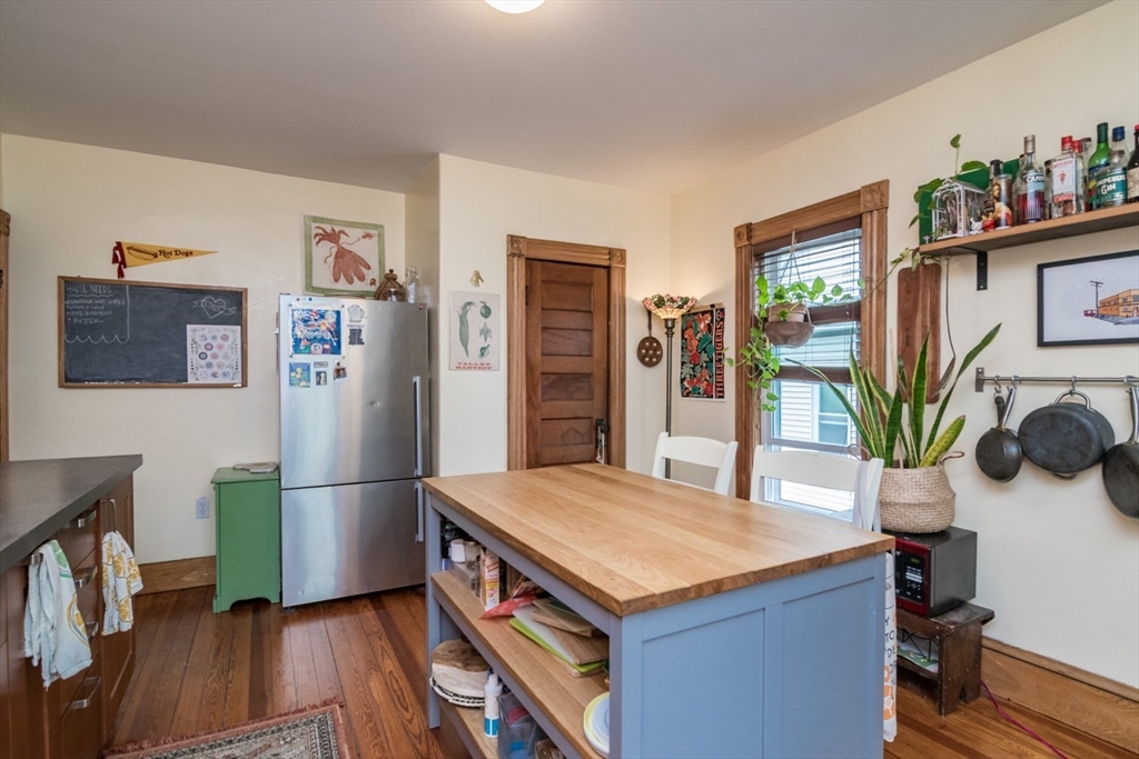 25 Morgan Street Holyoke, MA 01040 - Photo 22 of 41 a kitchen with granite countertop a refrigerator and a stove top oven